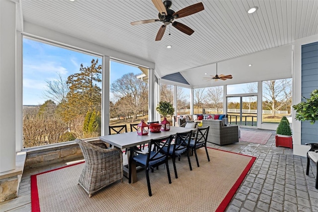 sunroom with wooden ceiling and vaulted ceiling