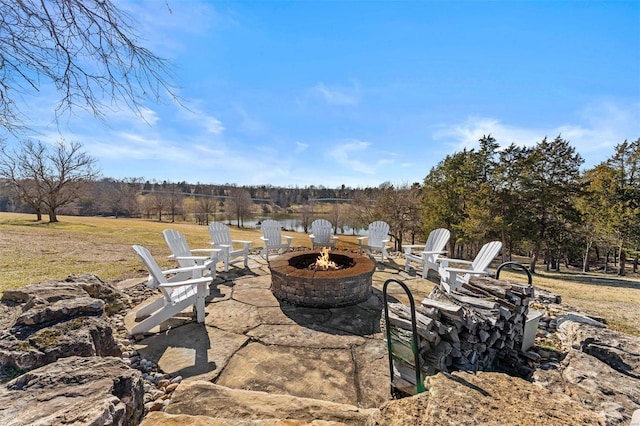 view of patio / terrace featuring a fire pit