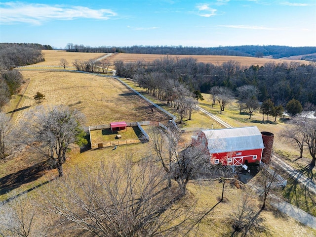 birds eye view of property with a rural view