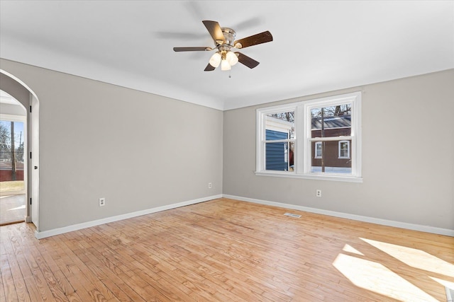 spare room with ceiling fan and light hardwood / wood-style floors