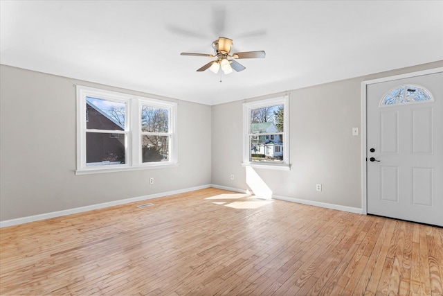 entryway with ceiling fan and light hardwood / wood-style floors