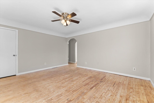 empty room featuring ceiling fan and light hardwood / wood-style flooring