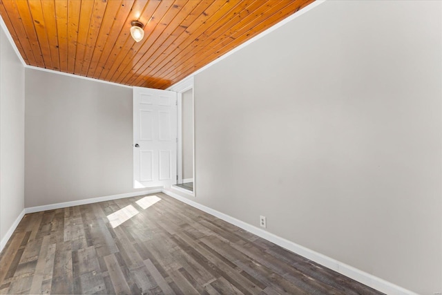 unfurnished room with crown molding, dark hardwood / wood-style floors, and wooden ceiling