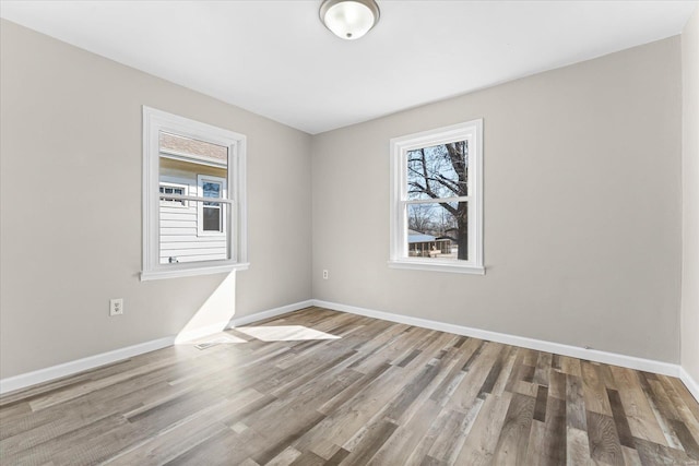 spare room featuring light wood-type flooring