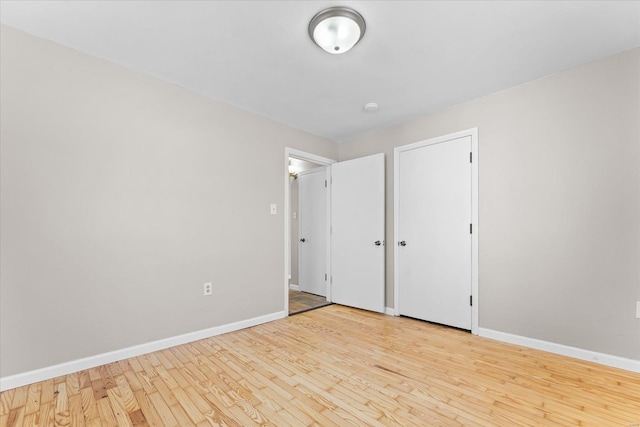 unfurnished bedroom featuring light wood-type flooring