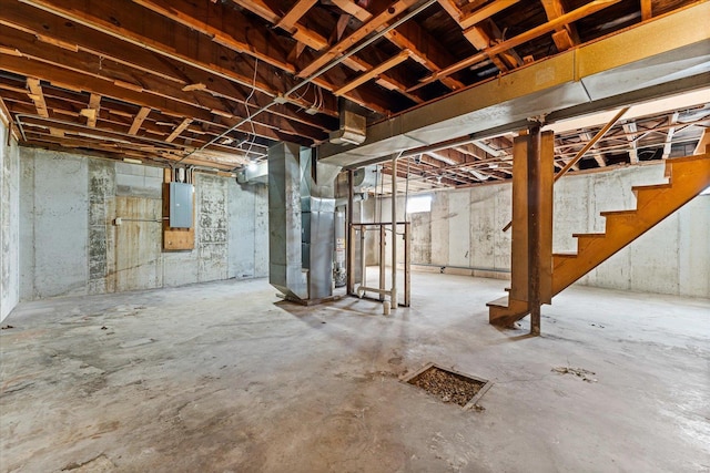 basement with heating unit and electric panel