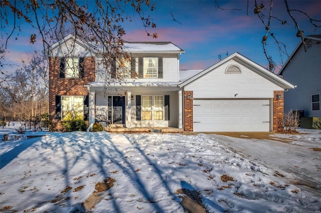 front of property with a garage