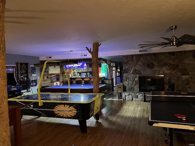 game room featuring hardwood / wood-style flooring and ceiling fan