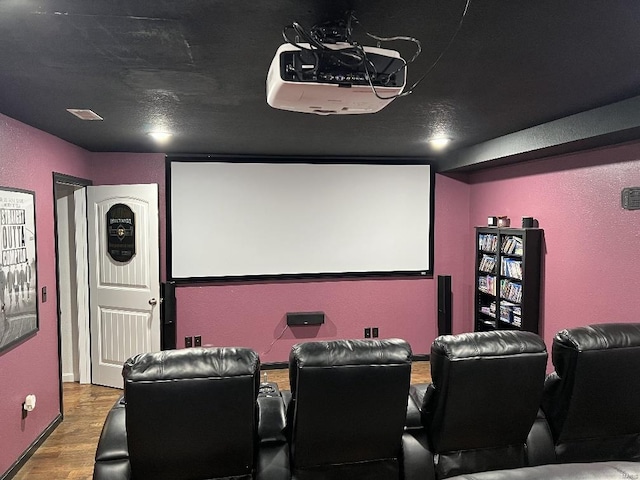 cinema featuring wood-type flooring