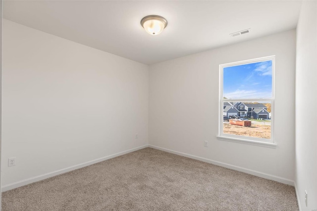 empty room featuring carpet flooring