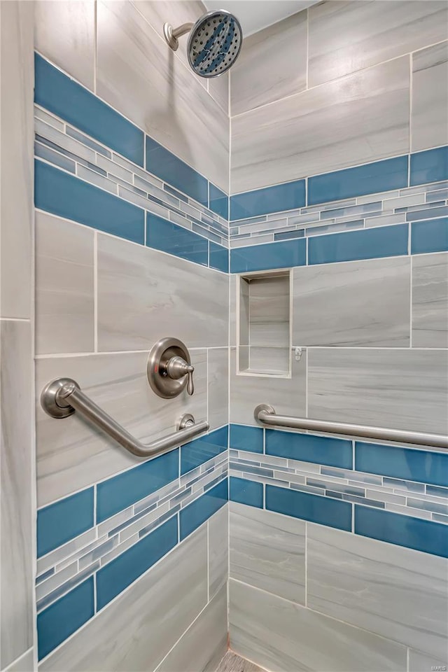 bathroom with tiled shower