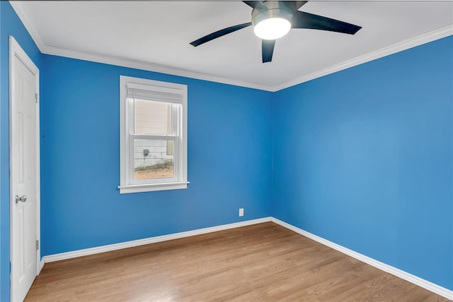 spare room featuring ceiling fan, light hardwood / wood-style floors, and ornamental molding