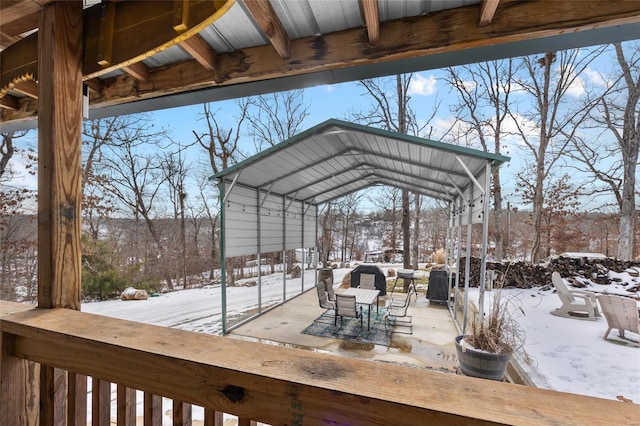 view of snow covered deck