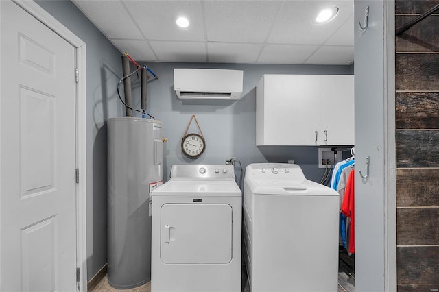 laundry area with washer and dryer, cabinets, electric water heater, and a wall mounted air conditioner