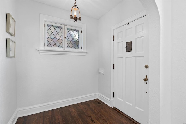 foyer featuring dark wood-type flooring