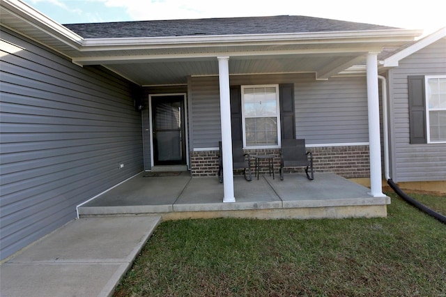 doorway to property featuring covered porch