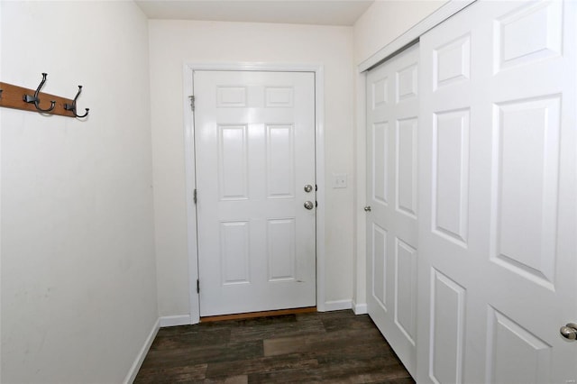 doorway with dark hardwood / wood-style flooring