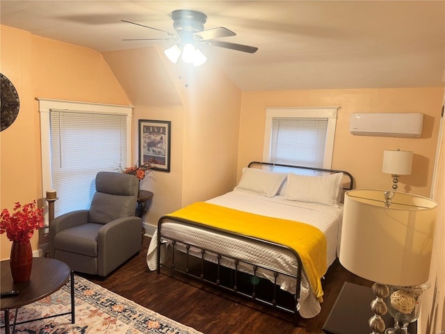 bedroom with hardwood / wood-style floors, a wall unit AC, ceiling fan, and lofted ceiling