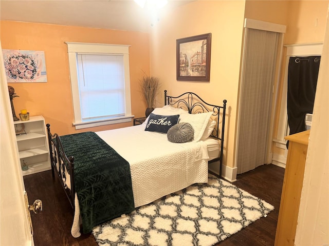 bedroom featuring dark hardwood / wood-style floors