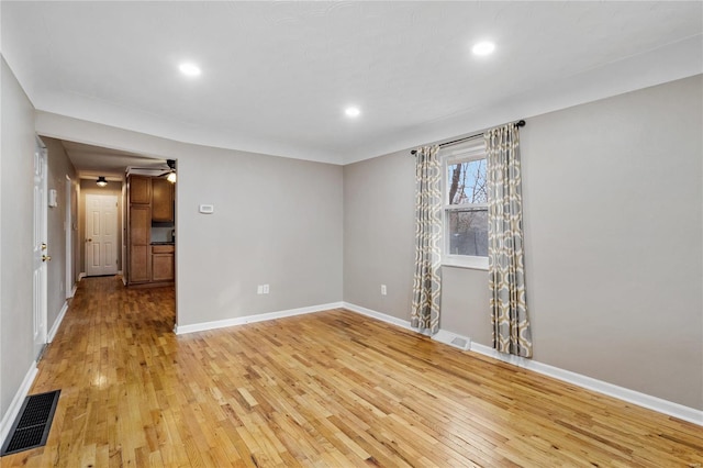 unfurnished room featuring light hardwood / wood-style floors