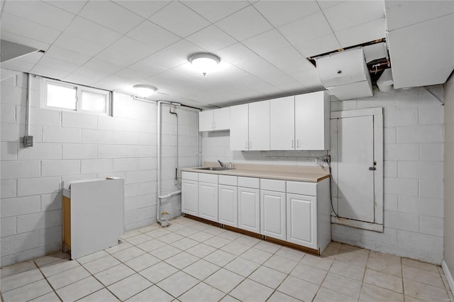 kitchen featuring white cabinets and sink