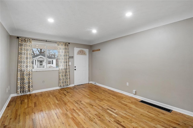 unfurnished room featuring hardwood / wood-style flooring