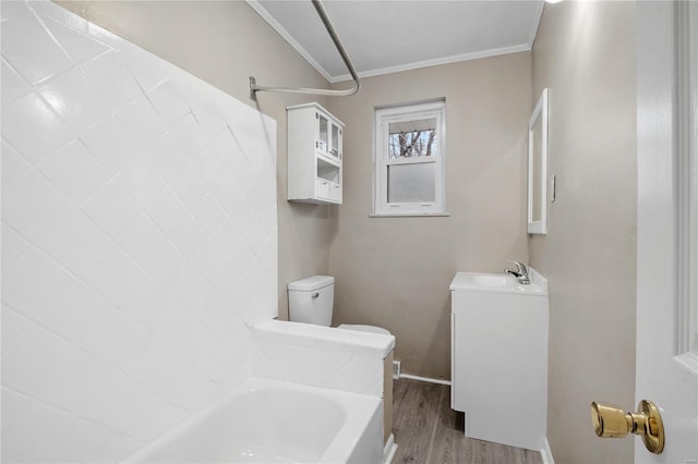 full bathroom featuring vanity, crown molding, shower / tub combination, hardwood / wood-style flooring, and toilet