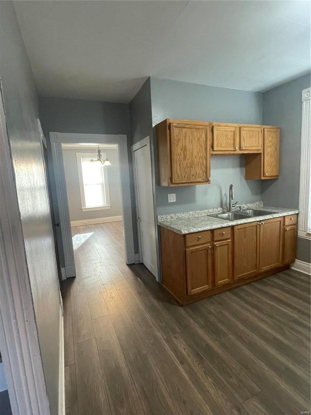 kitchen featuring sink and dark hardwood / wood-style floors