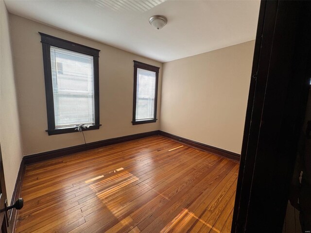 unfurnished room featuring wood-type flooring