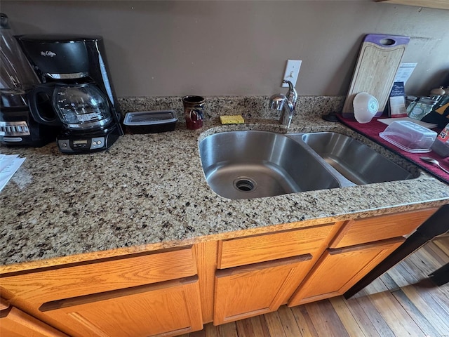 details with light stone countertops and sink