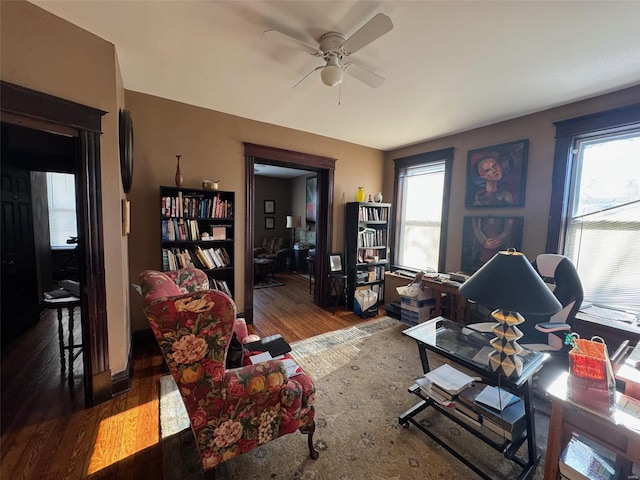 interior space with ceiling fan and wood-type flooring