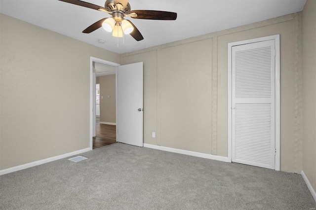 unfurnished bedroom with carpet floors and ceiling fan