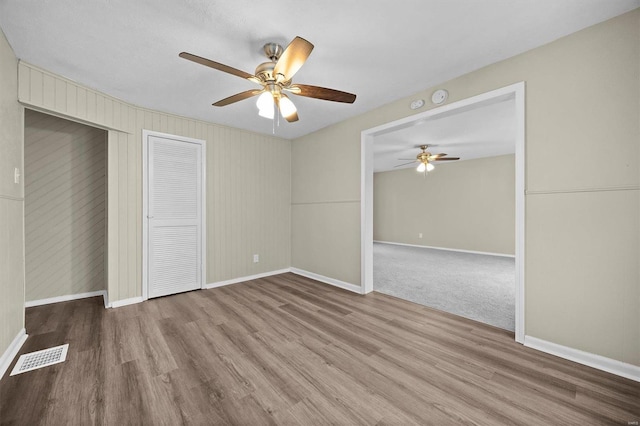 unfurnished bedroom with hardwood / wood-style flooring and ceiling fan