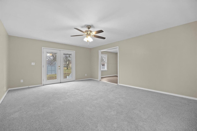 unfurnished room with ceiling fan, french doors, and carpet floors