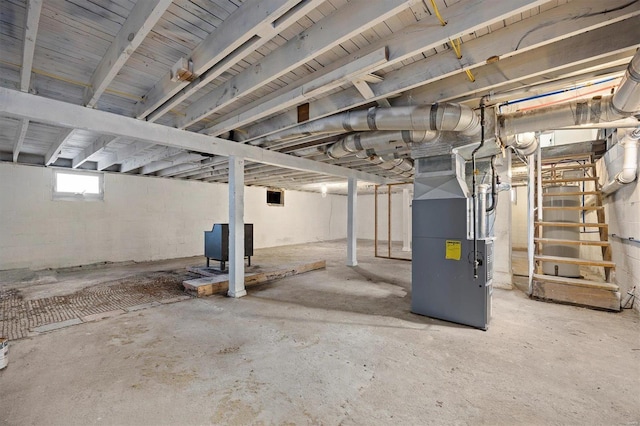 basement featuring heating unit