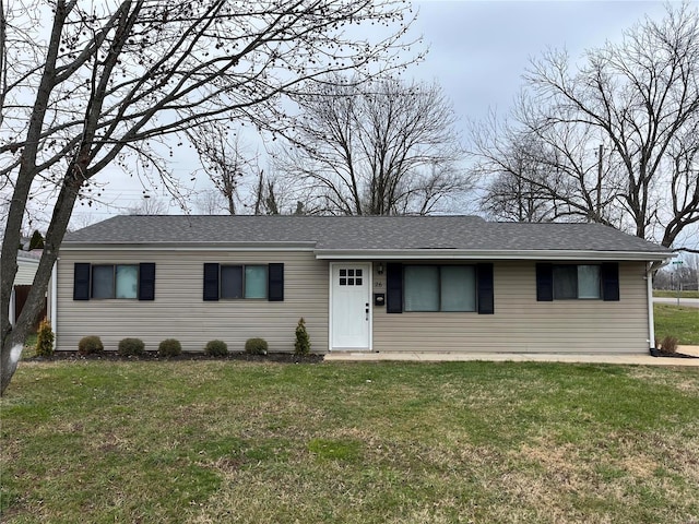 ranch-style house featuring a front yard