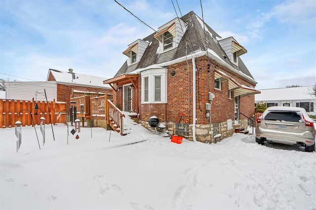 view of snow covered house