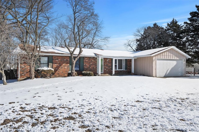 single story home with a garage and brick siding