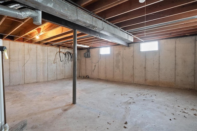 basement featuring electric panel and a wealth of natural light