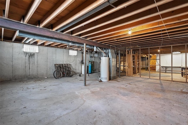 unfinished basement with water heater