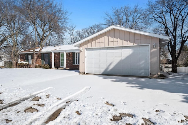 single story home with a garage, board and batten siding, and brick siding