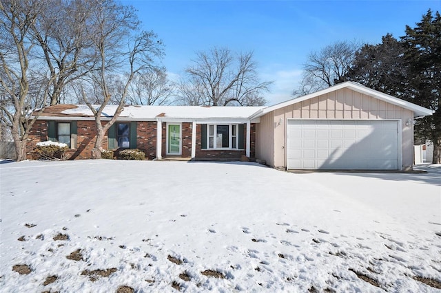 ranch-style home featuring an attached garage and brick siding