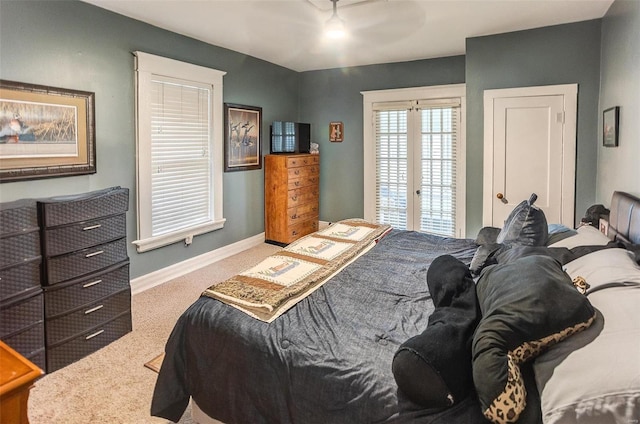 carpeted bedroom featuring ceiling fan and access to exterior