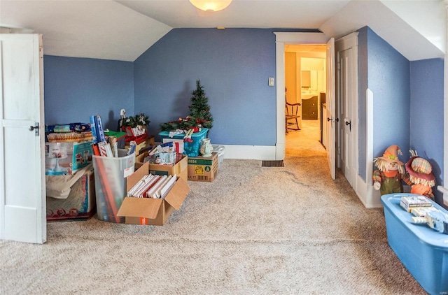 additional living space with carpet and vaulted ceiling