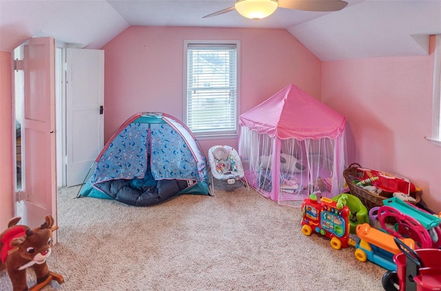 recreation room with carpet flooring, ceiling fan, and lofted ceiling