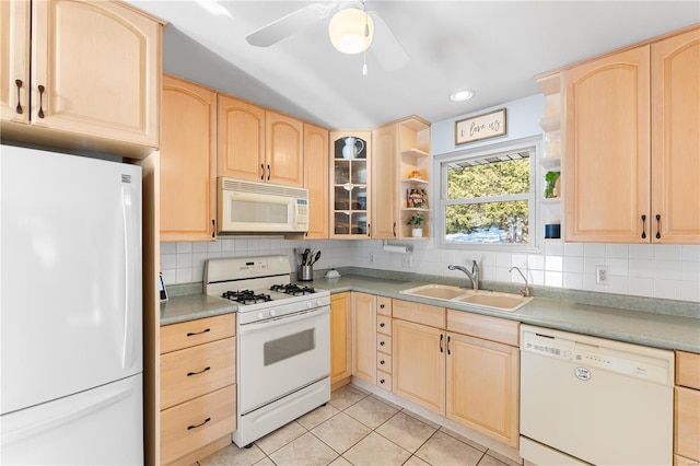 kitchen with decorative backsplash, sink, white appliances, light tile patterned floors, and light brown cabinetry