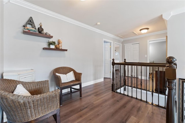 sitting room featuring dark hardwood / wood-style flooring and crown molding