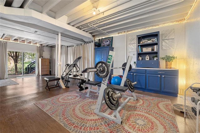 exercise area featuring built in shelves