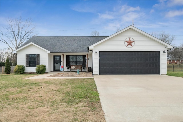 single story home featuring a garage and a front lawn