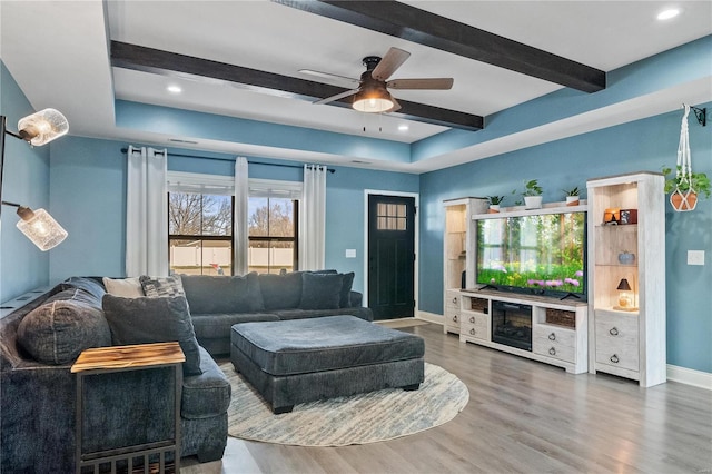 living room with ceiling fan and hardwood / wood-style flooring